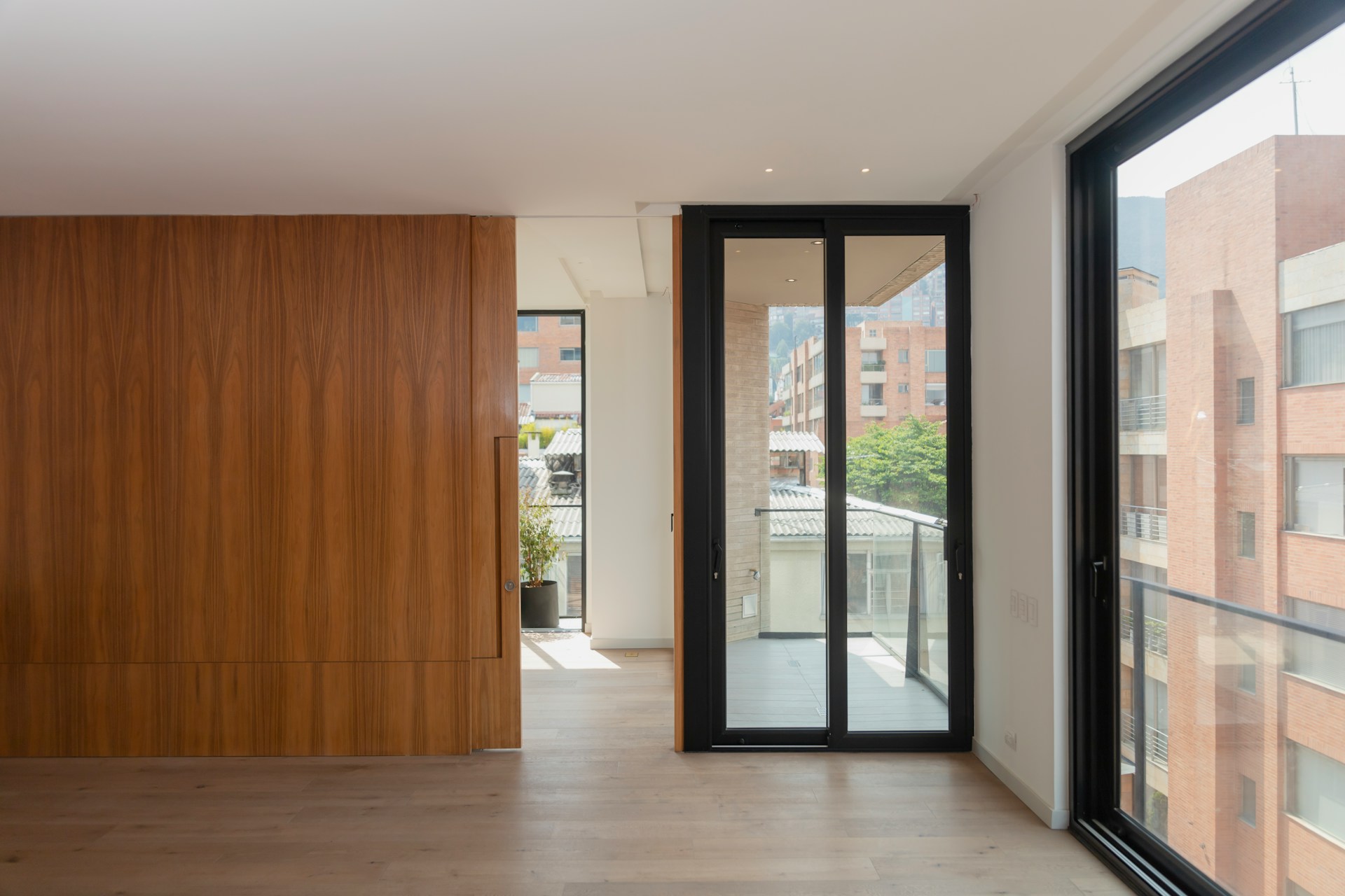 Room with wooden accent wall and natural light