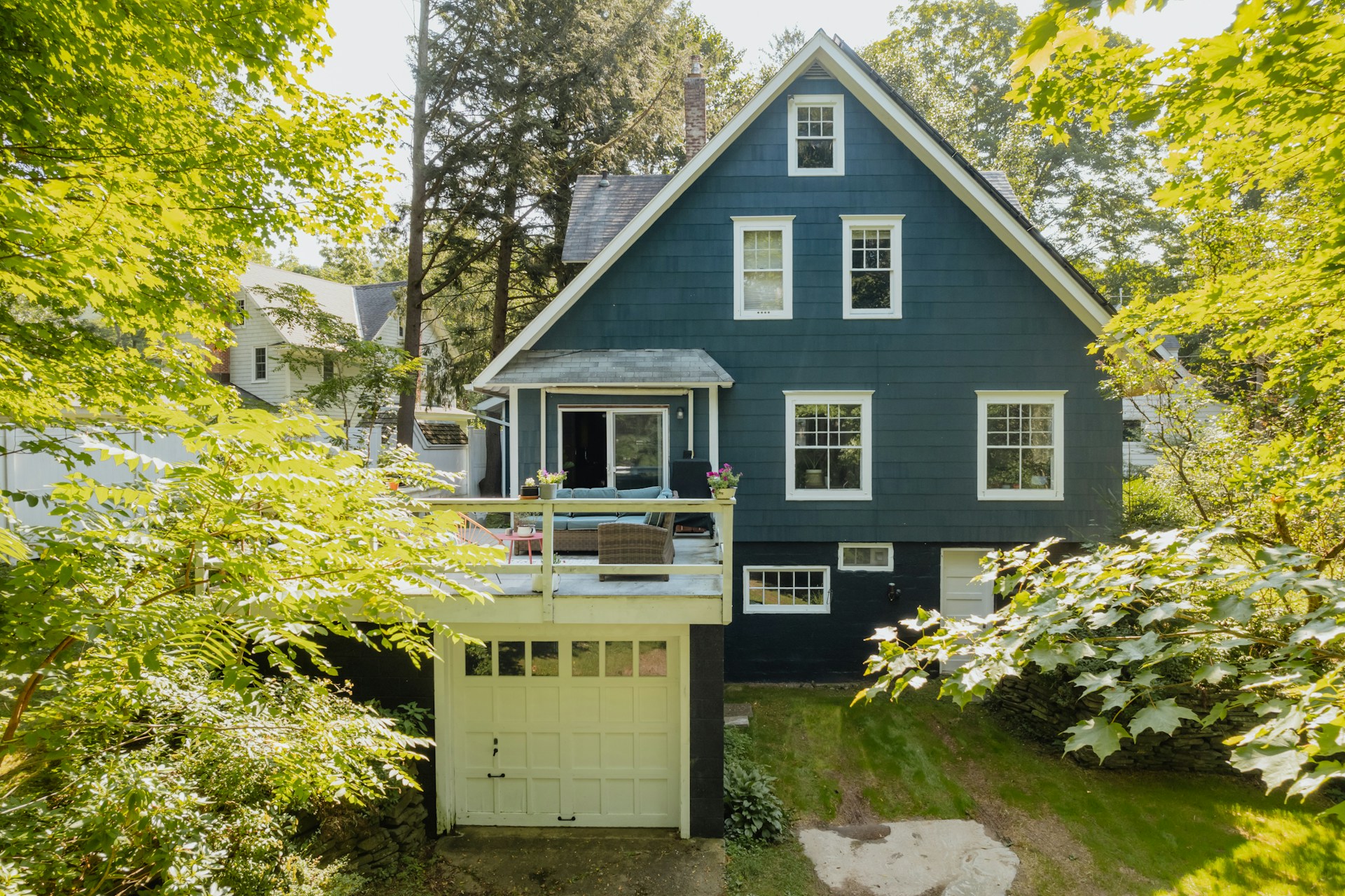 Blue house among trees