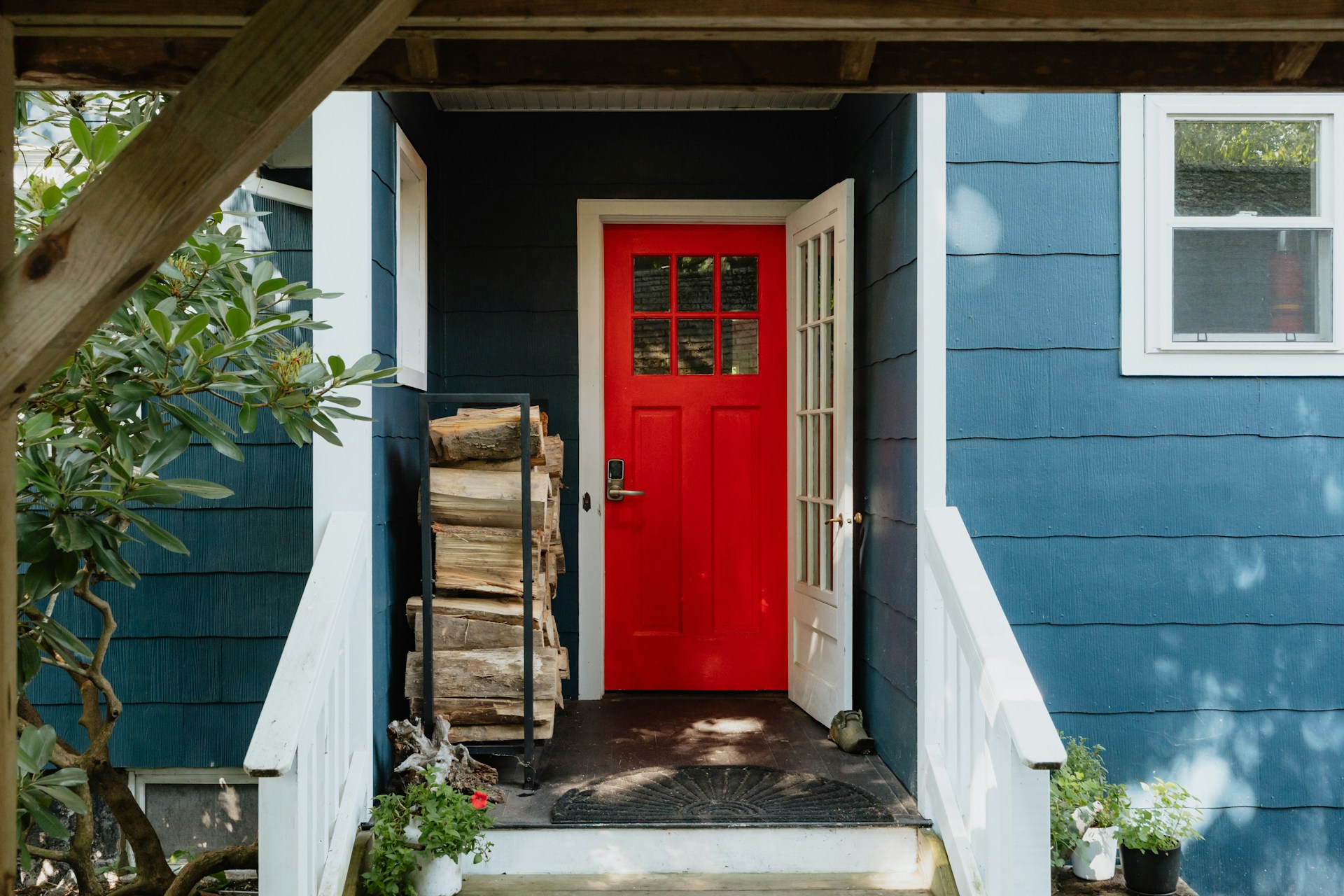 Charming blue house with red front door