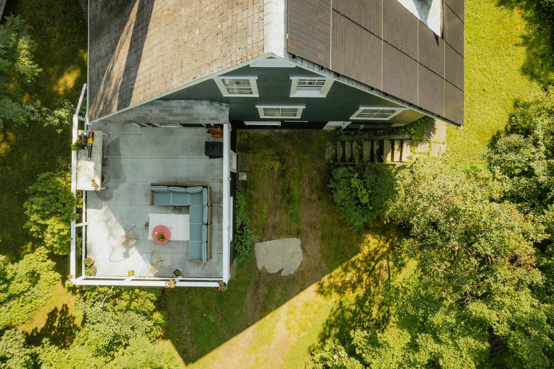 Aerial view of house surrounded by trees
